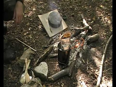 Making a clay pot at the camp fire
