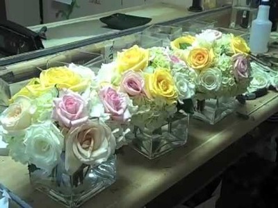 Designing cube vases with roses + hydrangeas.
