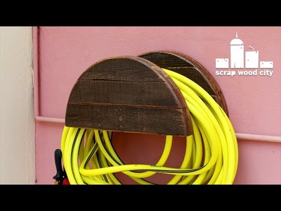 DIY garden hose hanger out of pallet wood
