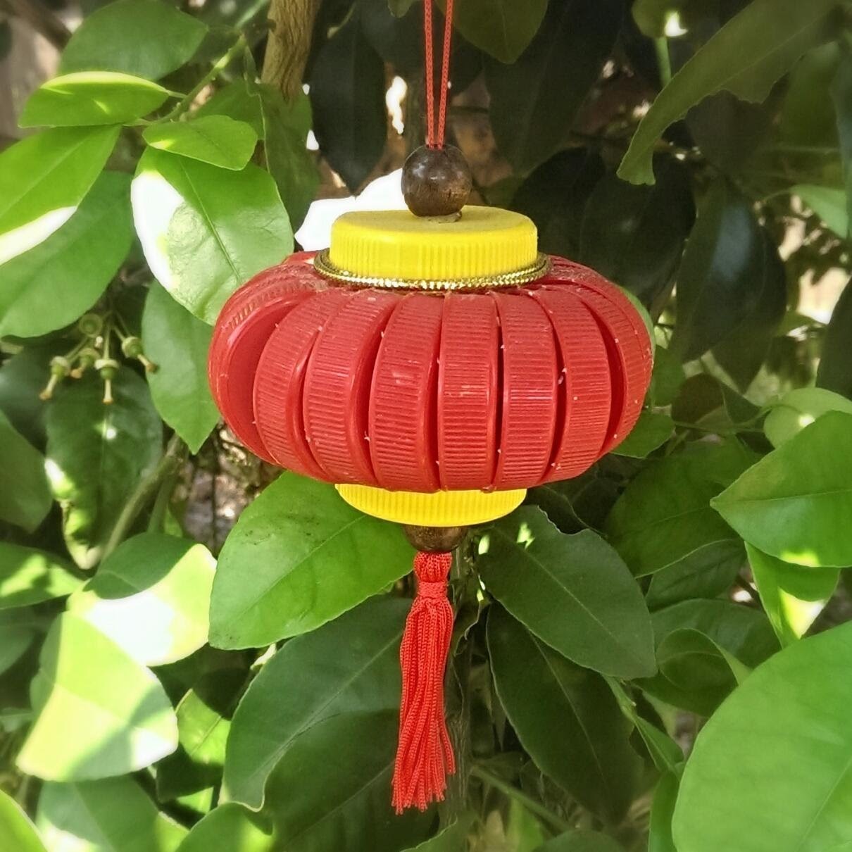 Recycled bottle cap lantern