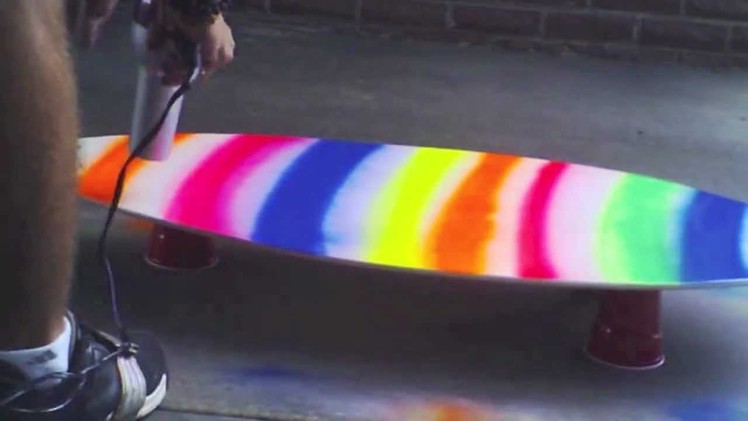 Soap painting a skimboard