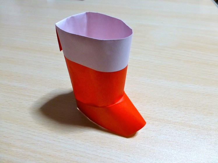 The art of folding paper. Santa boots