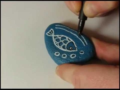 How to paint a stone and decorate it with a fish doodle