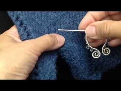 How to clasp a scarf with a penannular brooch