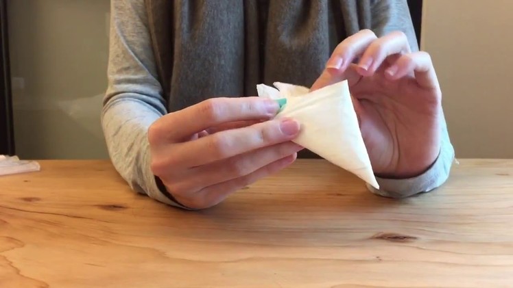 How to fold a plastic bag into a triangle to save space