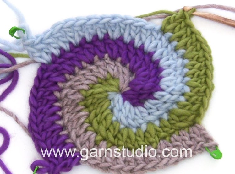 DROPS Crocheting Tutorial: How to work a Pot holder with stripes and spiral.