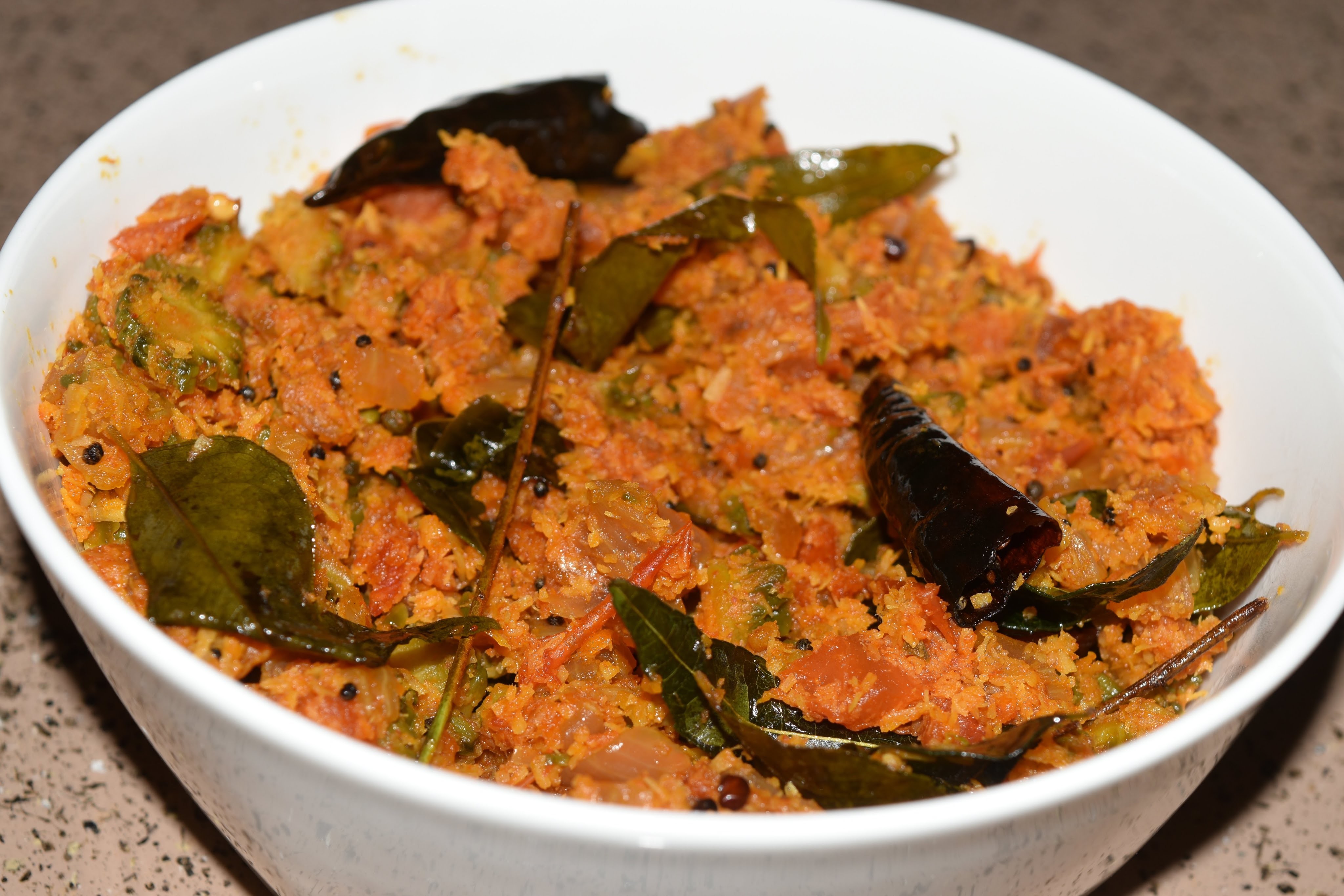 Vegetarian - How to prepare Pavakka Thoran (Bitter gourd Tomato)