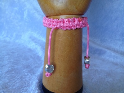How to make a micro paracord friendship bracelet with peace beads and a sliding knot clasp.