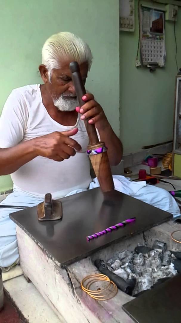 Traditional resin bangle maker in Churu, Rajasthan