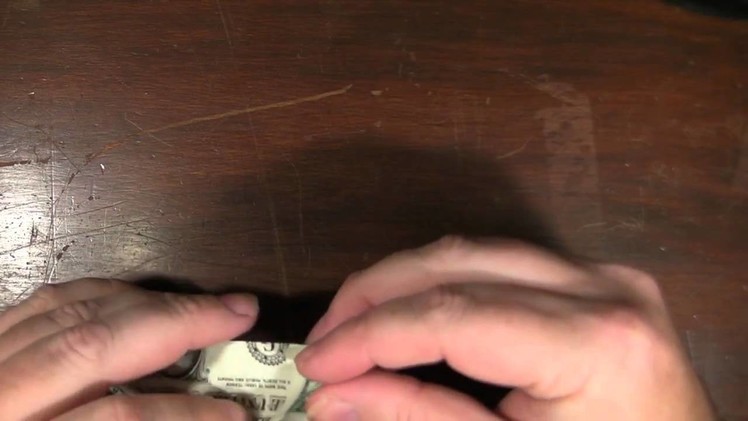 Origami Rhino with a US dollar bill