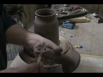 THROWING A WATERING CAN ON THE WHEEL PART 2.wmv