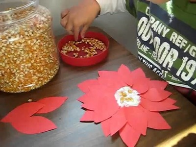 Christmas. Arts and Crafts activity: Red color paper and popcorn poinsetta flowers.