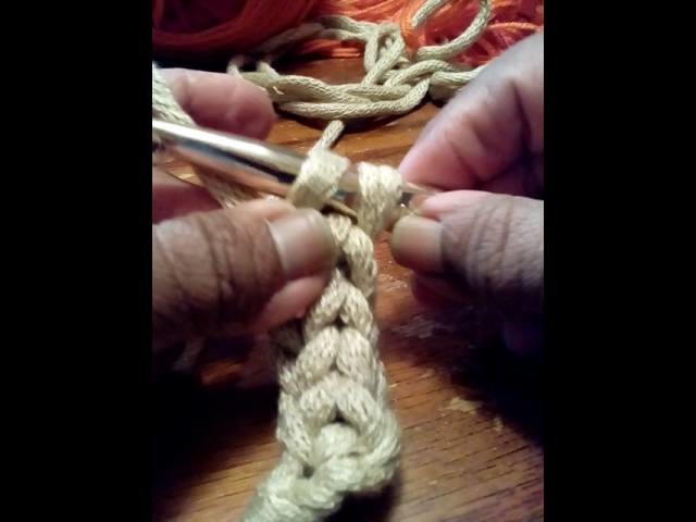 Demostrating Lucet crochet cord with a large N hook or 10mm
