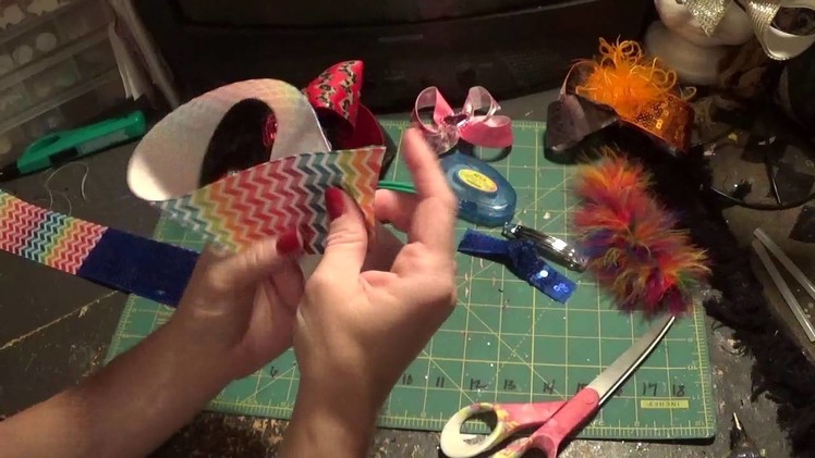 How to make a sequin two toned hair bow and add feathers.