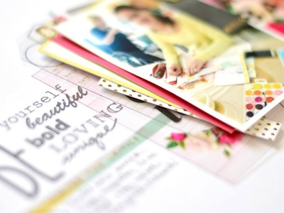 Stamping as finishing touch on scrapbook layout