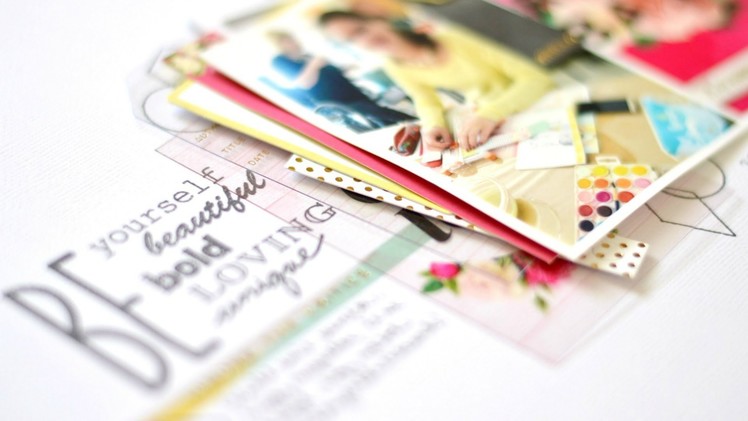 Stamping as finishing touch on scrapbook layout