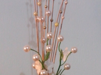 How to make a pearl and flower sticks.