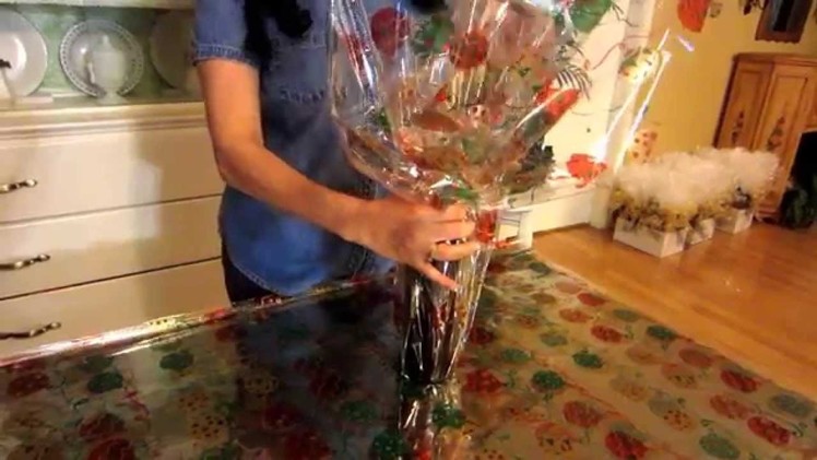 Wrapping a bottle in cellophane