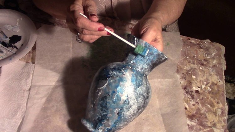 Saundra Meades       DIY, how to paint a clear glass vase with glass paint.