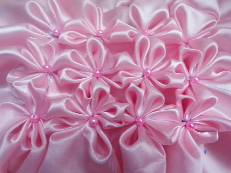 8 petal flower smocking pattern on a fabric