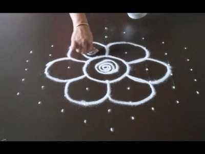 Simple flower kolam with 9 Dots to 5 interlaced