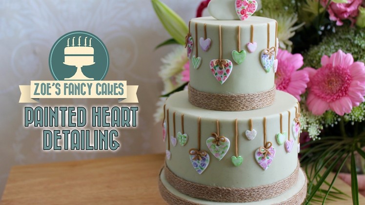 Painted heart detailing on a cake