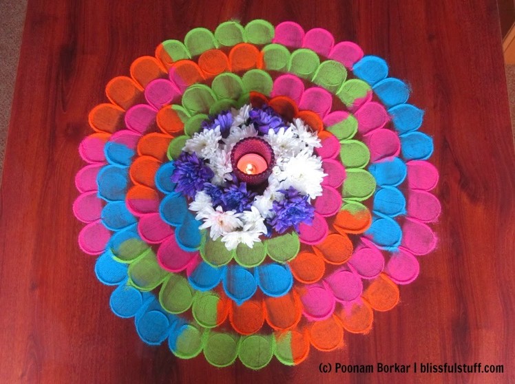 Quick and easy multicolored flower shaped rangoli using tealight candle | Rangoli by Poonam Borkar