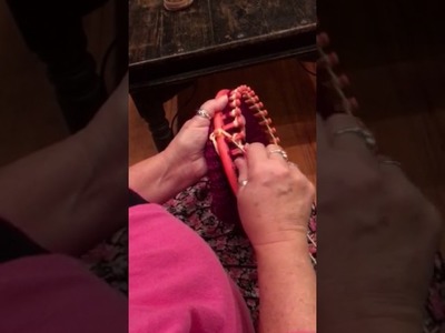 Knitting hats on a loom. Changing colors