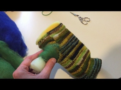 Repairing knitting with needle felting