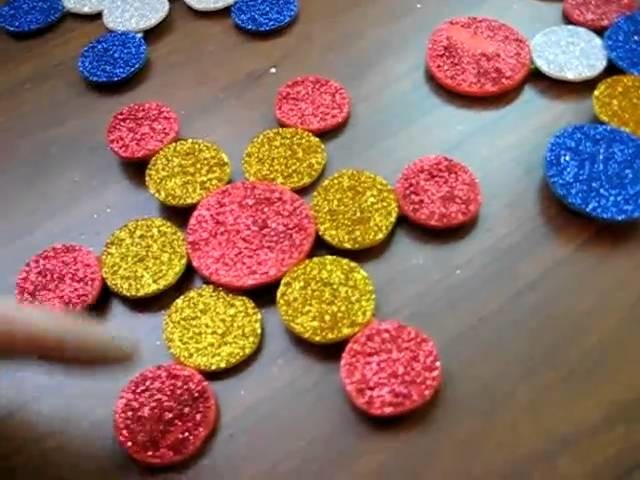 Christmas. Arts and Crafts: Color glitter foam snowflakes on Popsicle sticks activity.