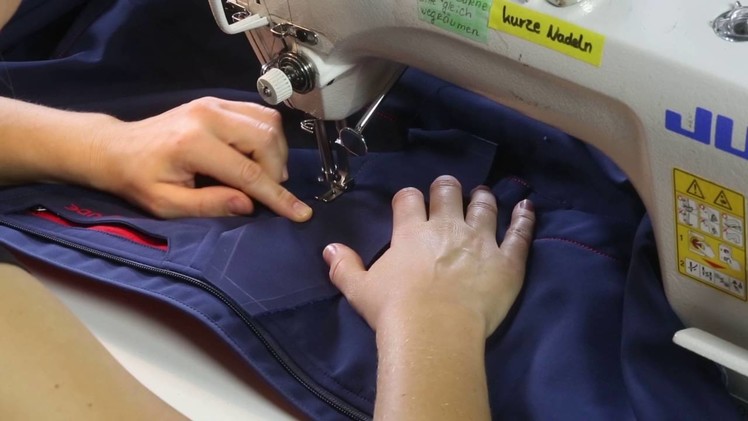 Sewing the patch on the jacket  | VAUDE