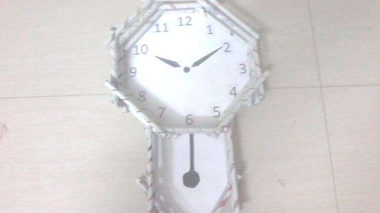 DIY: How to make pendulum wall clock using news paper rolls - best out of waste project