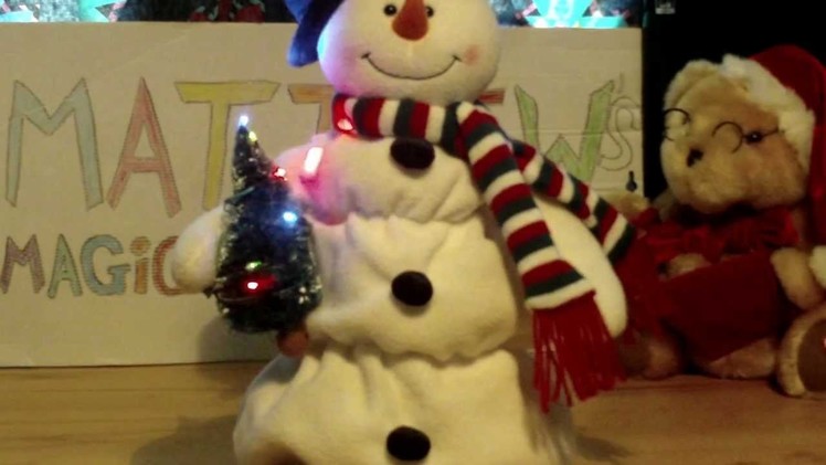 Melting Snowman with christmas tree singing frosty the snowman while melting