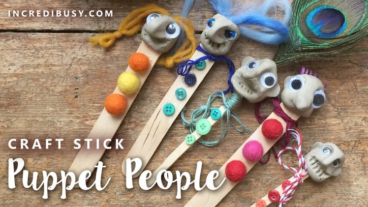 Craft Stick Air Drying Clay Puppet - with buttons, googly eyes and a peacock feather!