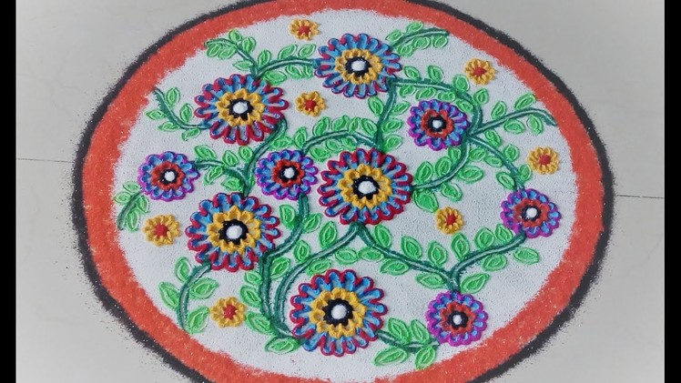 How to make Beautiful flowers in simple Rangoli designs.