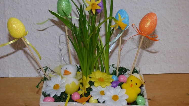 How to make an Easter basket centerpiece with flowers and eggs.