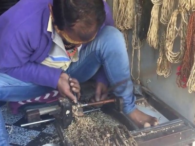 Hand crafting Tulsi Beads