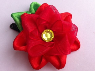 The decoration on the hairpin Kanzashi. the Red flower of satin and organza