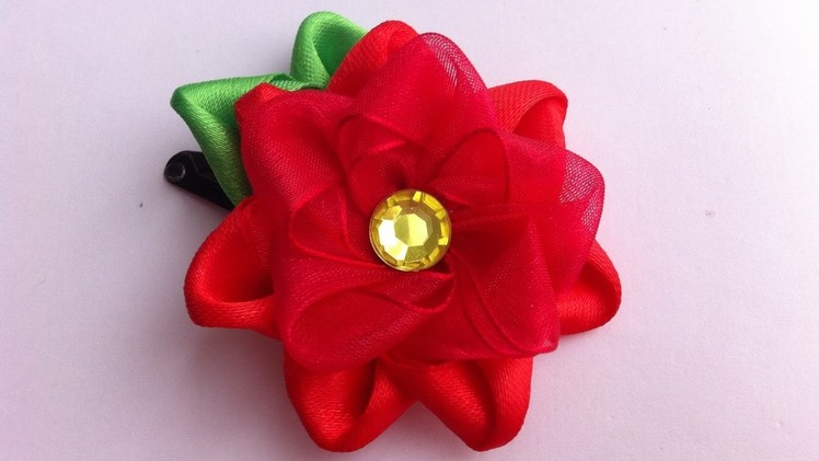 The decoration on the hairpin Kanzashi. the Red flower of satin and organza