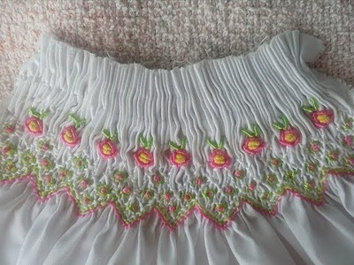 Smocking embroidery with Roses using Bullion stitch on the chest of a dress