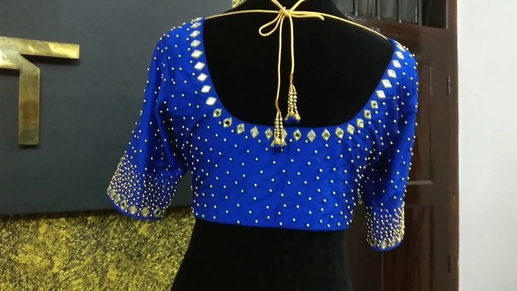 Thick beadwork blouse with mirror on neckline