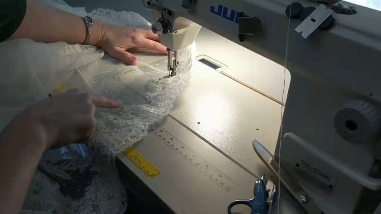 How to sew a lace applique hem onto a bridal gown. Hem a lace wedding dress.