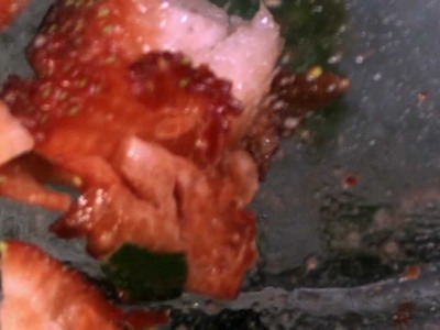 Strawberry dropped into a blender in slow motion