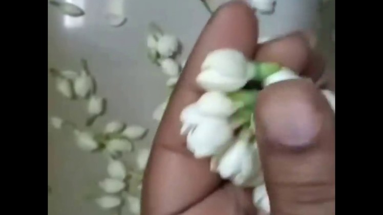 Simple and traditional method to string jasmine flower.