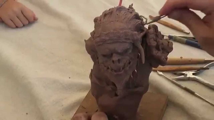 Orc demo sculpture in a miniature convention by Roquelaine Cyril