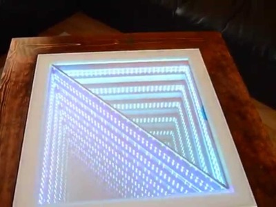 Square coffee table with triangle 3D infinity effect