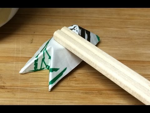 Origami chopstick rest 1 - folded out of a chopstick wrapper, Hashioki, origami chopstick holder