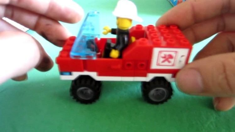 Assembles a forklift toy with lego brick