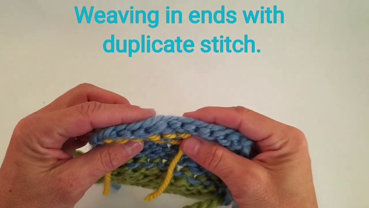 Weaving ends in knitting using duplicate stitch.