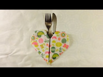 How to fold a napkin into a heart shape.